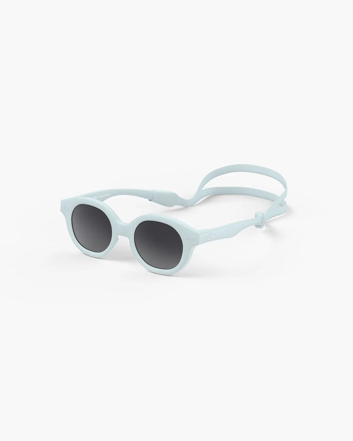 IZIPIZI Baby #C Sweet Blue polarized sunglasses for children aged 0–3 with a soft pastel blue frame and grey lenses