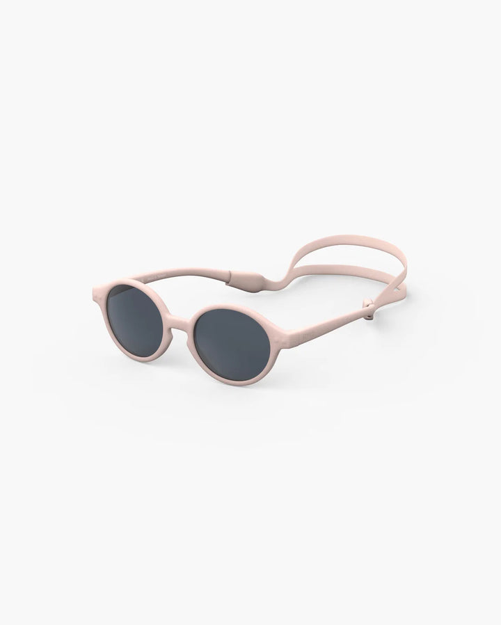 IZIPIZI Baby #D Pastel Pink polarized sunglasses for toddlers aged 0–3 with a soft matte pink frame and grey lenses
