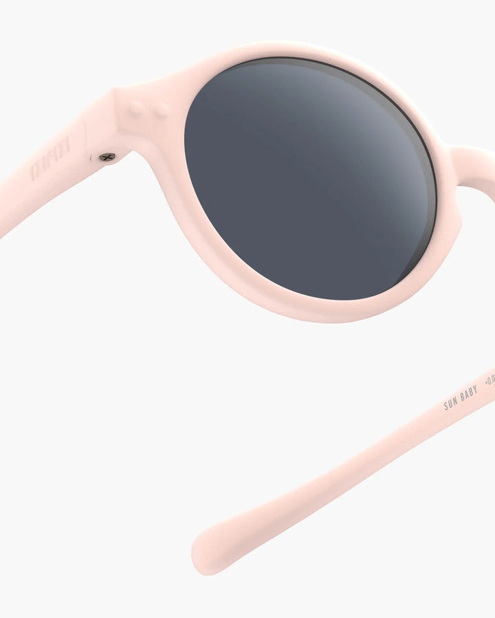 IZIPIZI Baby #D Pastel Pink polarized sunglasses for toddlers aged 0–3 with a soft matte pink frame and grey lenses