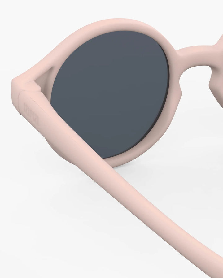 IZIPIZI Baby #D Pastel Pink polarized sunglasses for toddlers aged 0–3 with a soft matte pink frame and grey lenses
