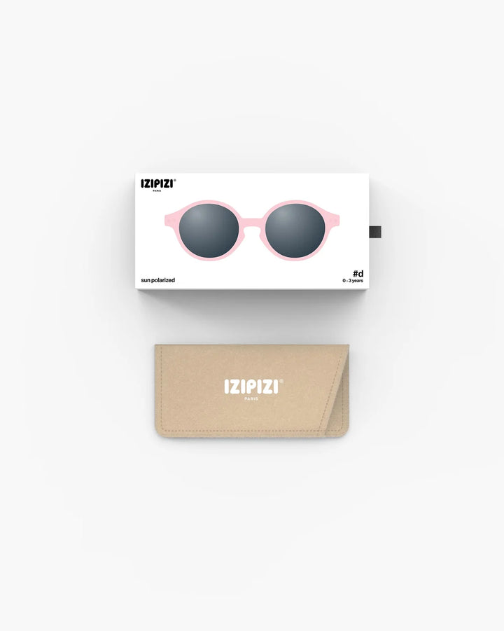 IZIPIZI Baby #D Pastel Pink polarized sunglasses for toddlers aged 0–3 with a soft matte pink frame and grey lenses