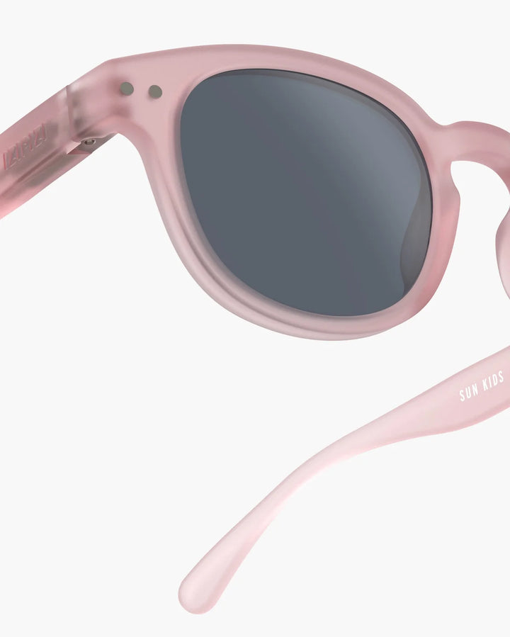 IZIPIZI CHILD #C Pink polarized kids sunglasses with soft-touch pale pink frame, grey-green lenses and 100% UV protection