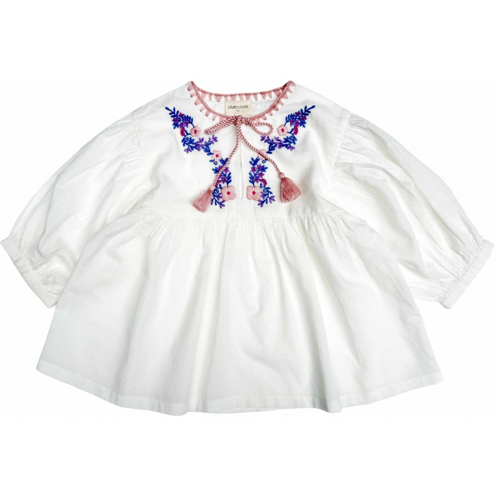 Girls off white cotton tunic with colorful floral embroidery and tassel ties