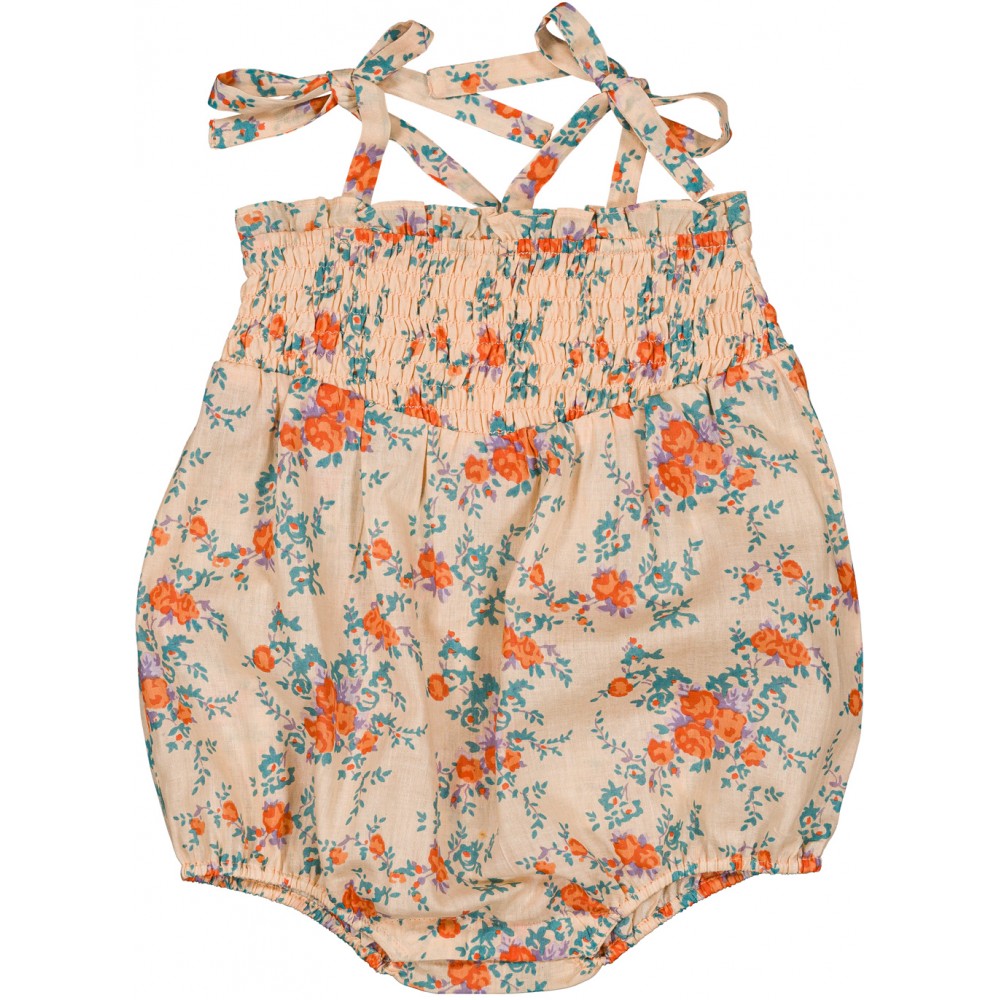 Baby floral cotton romper with smocked bodice and tie shoulder straps