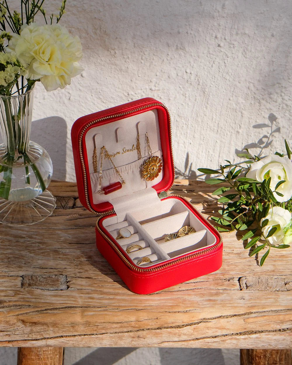 Red travel jewelry box with organised compartments by Maison Scarlett