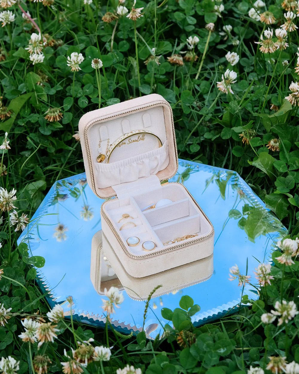 Beige velvet travel jewelry box with organised compartments by Maison Scarlett