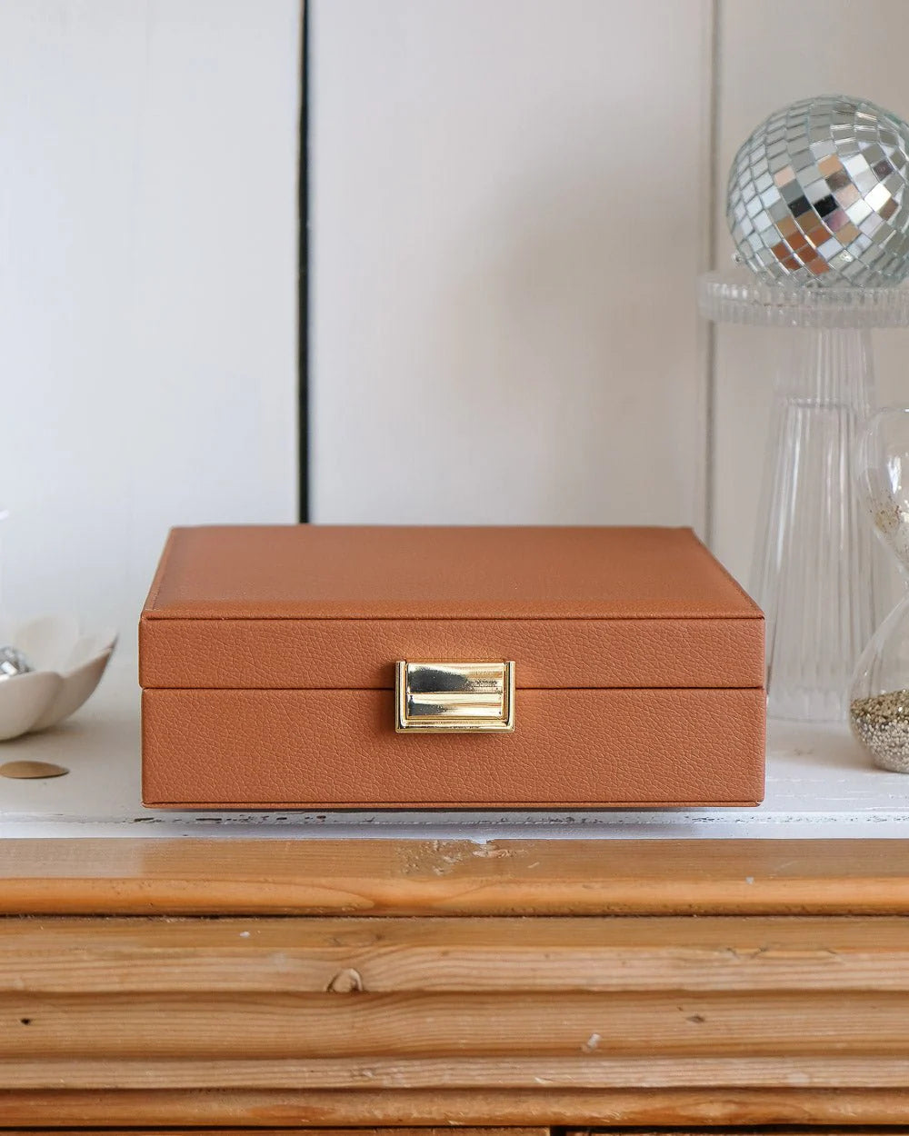 Cognac leather jewelry box with gold clasp by Maison Scarlett