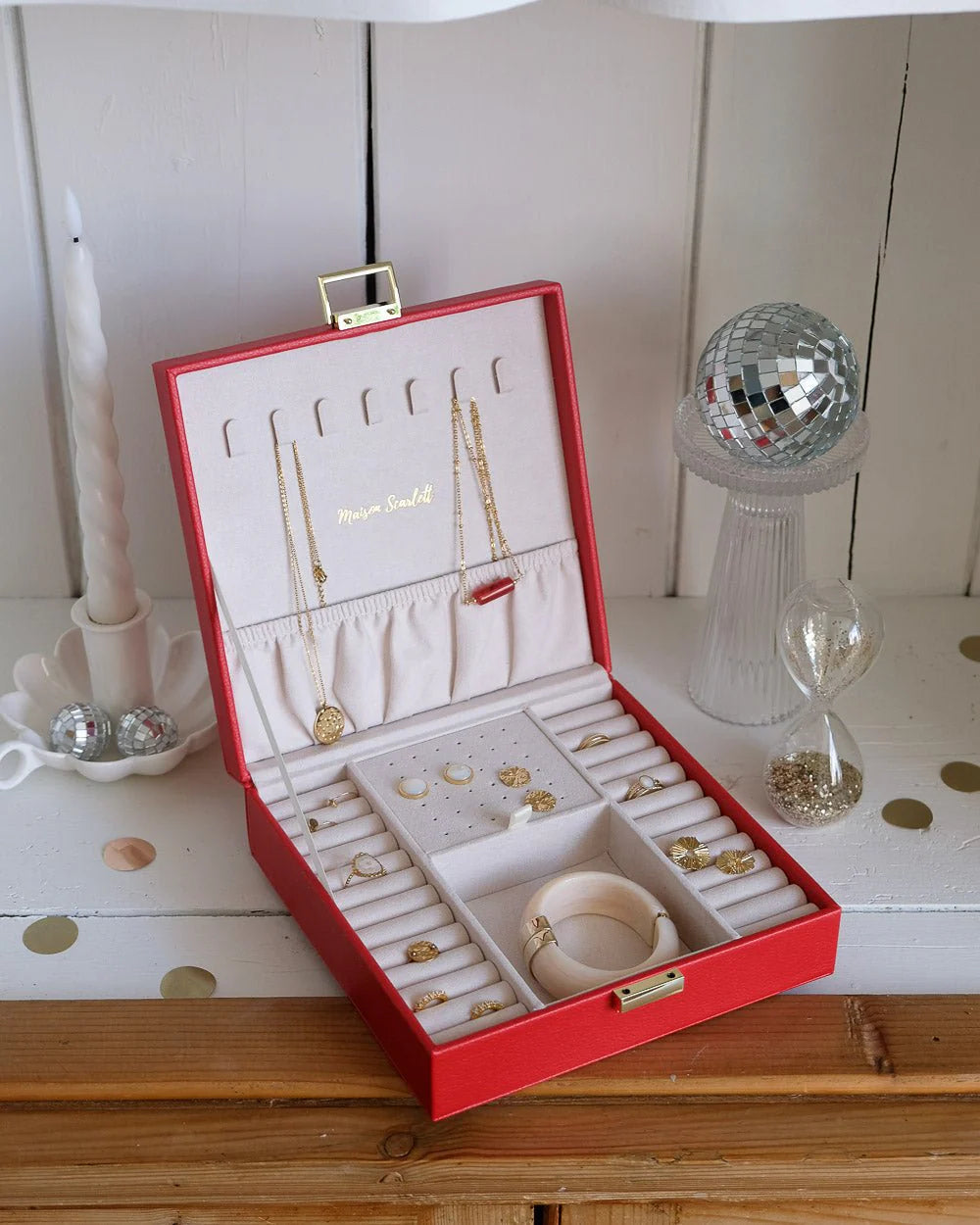 Red leather jewelry box with gold clasp by Maison Scarlett