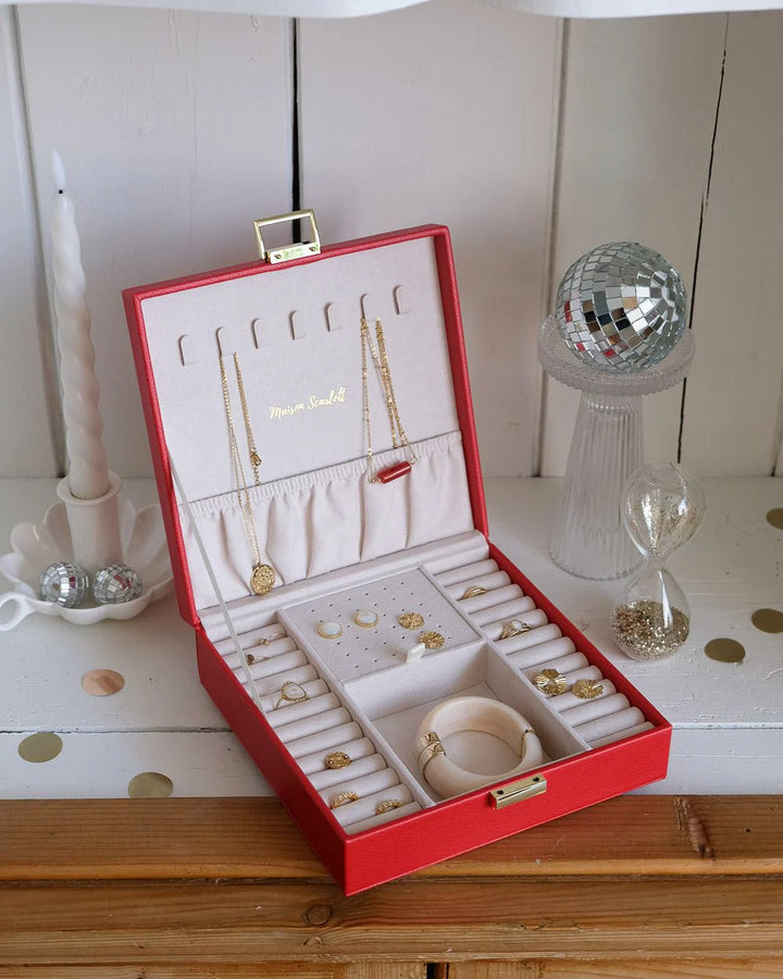 Red leather jewelry box with gold clasp by Maison Scarlett