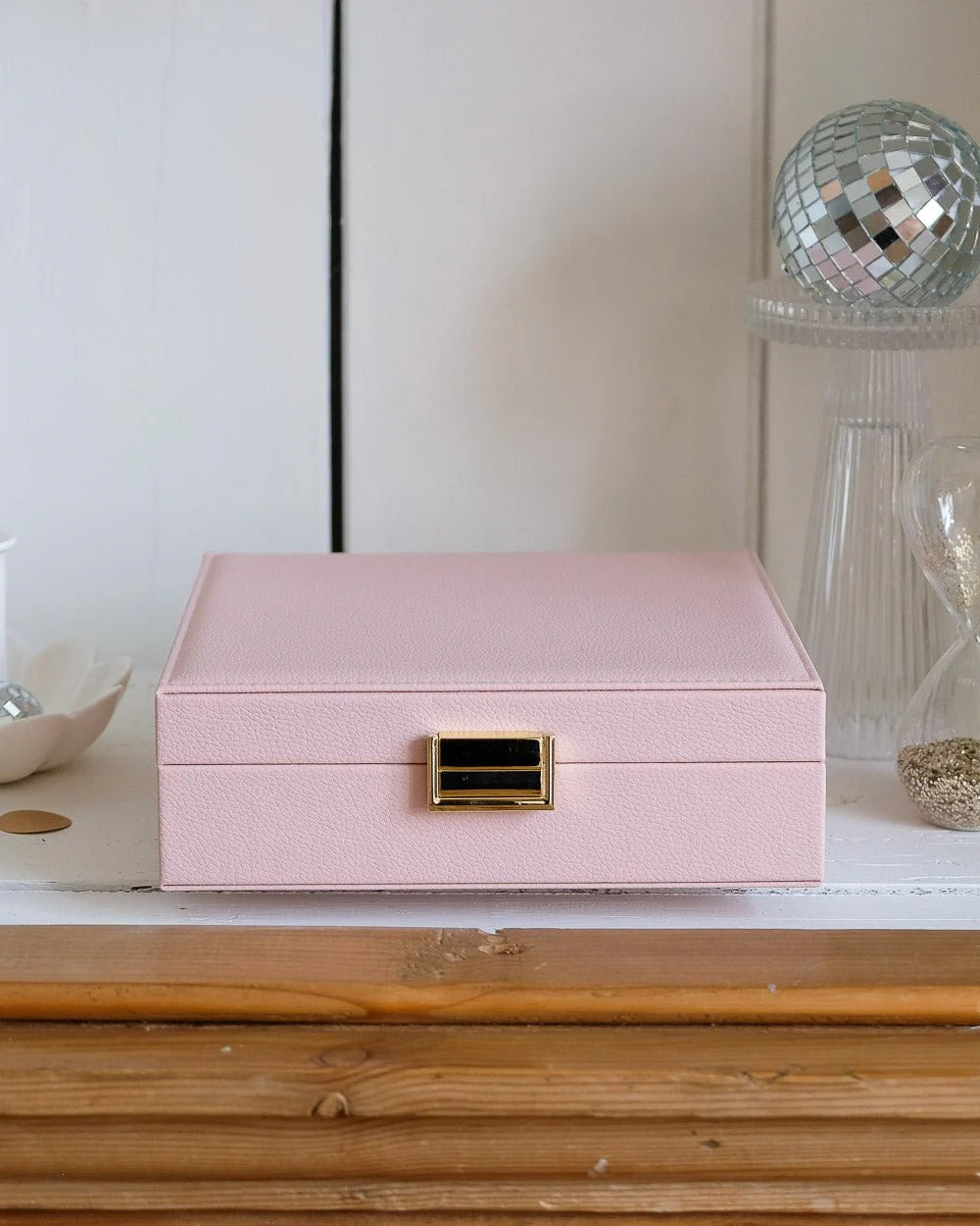 Pink leather jewelry box with gold clasp by Maison Scarlett