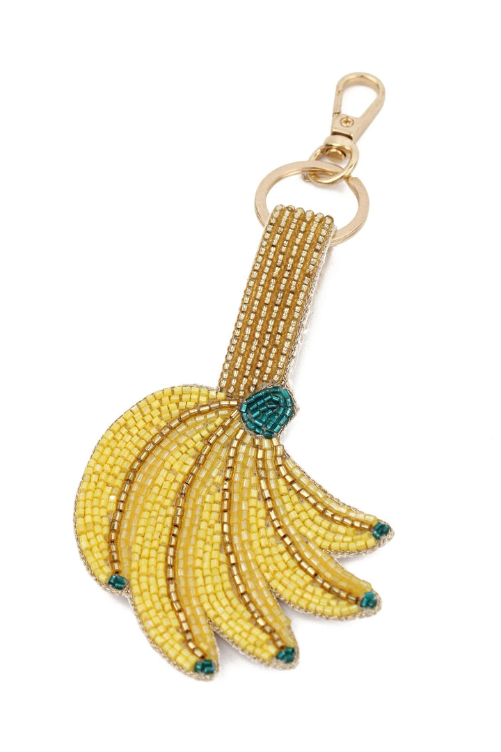 Handcrafted yellow and gold banana beaded keyring and bag charm with green detailing