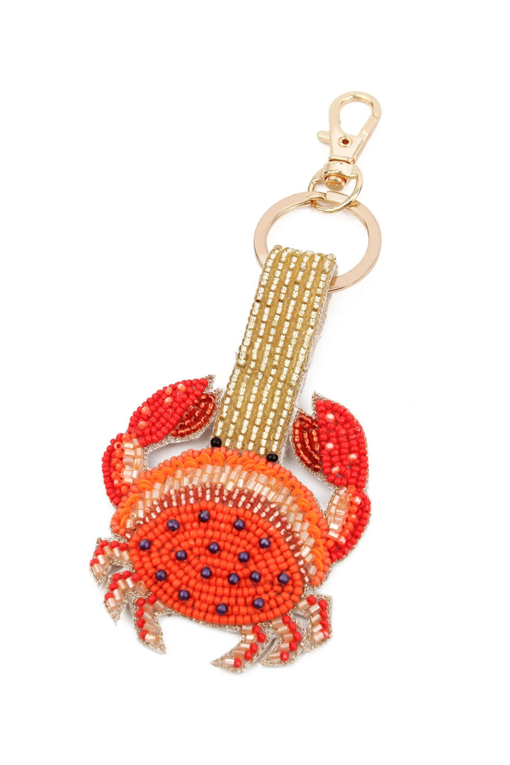Gold and orange crab beaded keyring and bag charm with shimmering beadwork