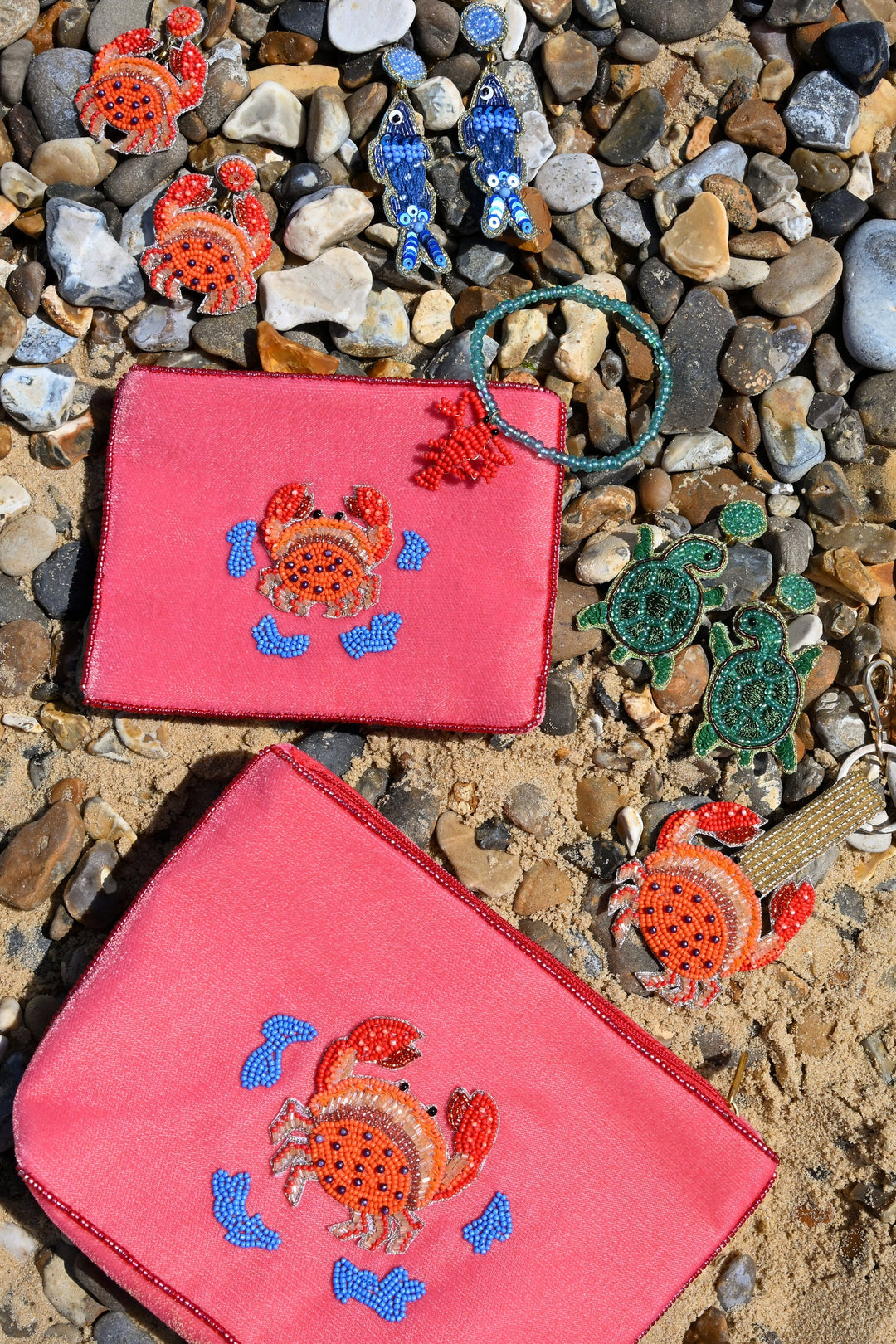 Coral velvet crab beaded pouch with gold, orange and blue beadwork
