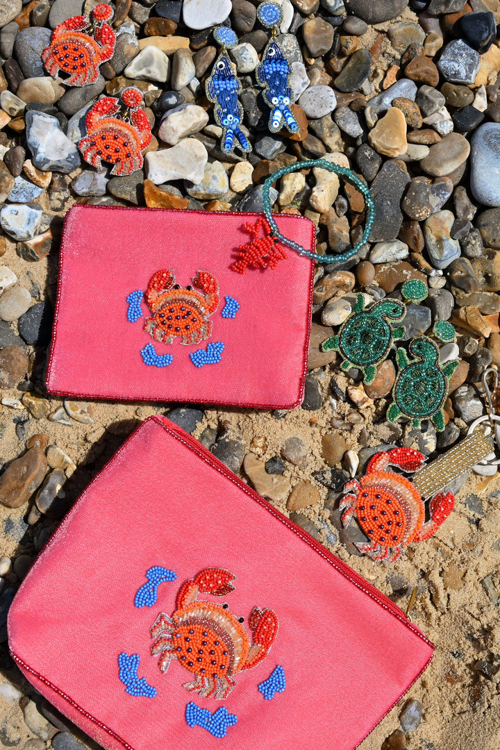 Coral velvet crab beaded pouch with gold, orange and blue beadwork