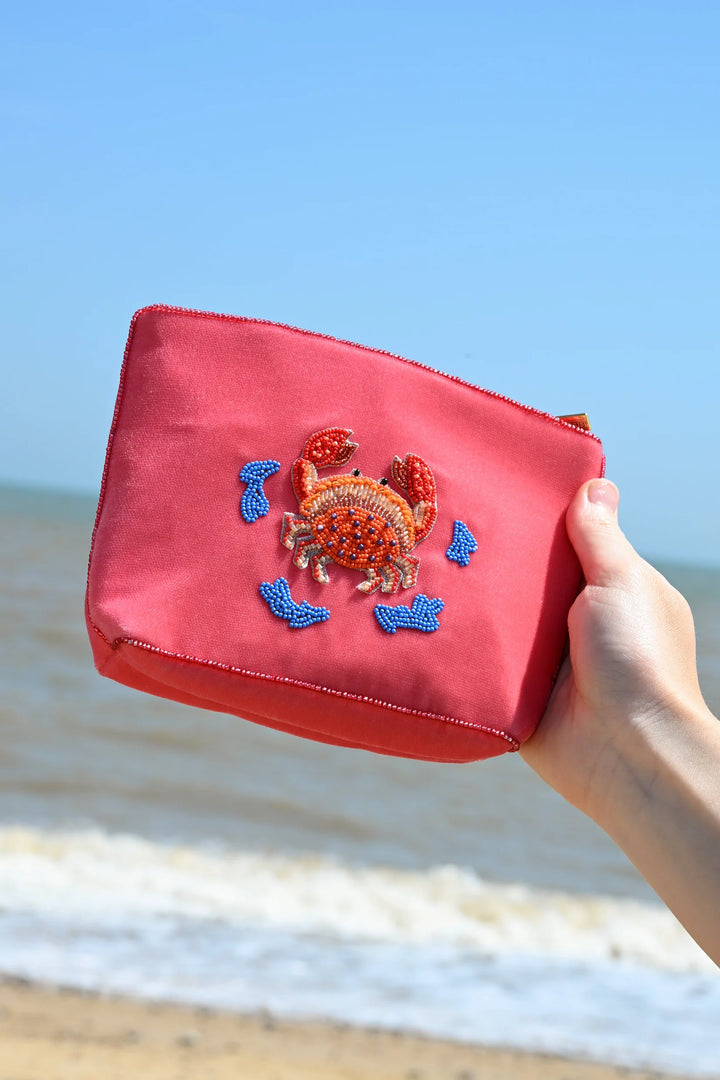 Coral velvet crab beaded pouch with gold, orange and blue beadwork