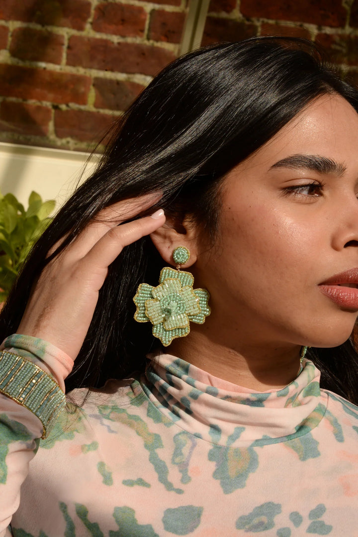 Handcrafted mint flower statement earrings with intricate glass bead detailing