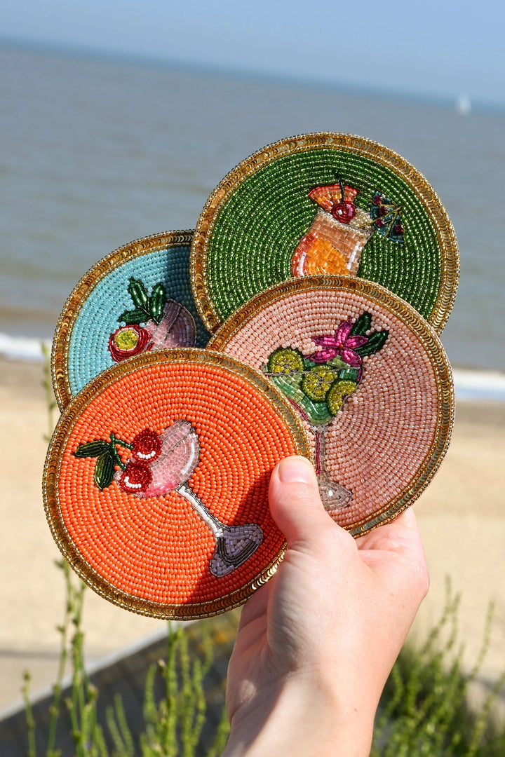 Set of four colourful beaded cocktail coasters with glass beads and sparkling sequin borders