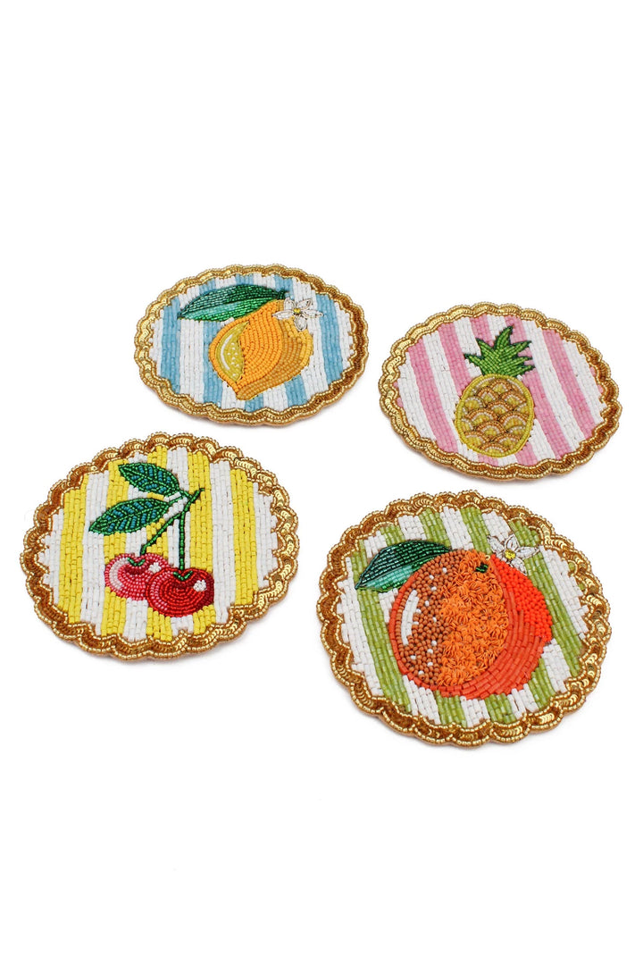 Set of four colourful beaded fruit coasters with striped backgrounds and scalloped sequin edges