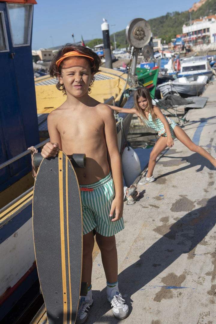 boys green striped swim shorts elastic waistband
