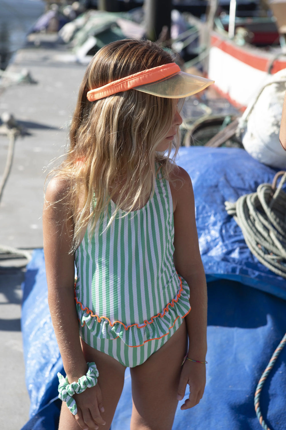 girls green striped swimsuit ruffle waist orange trim
