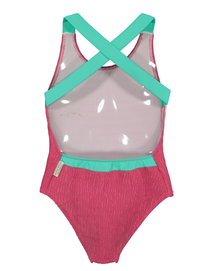 girls pink textured swimsuit with green cross back straps
