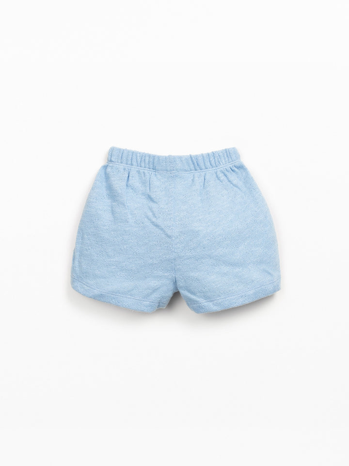 Baby organic cotton light blue shorts with elastic waistband and relaxed fit