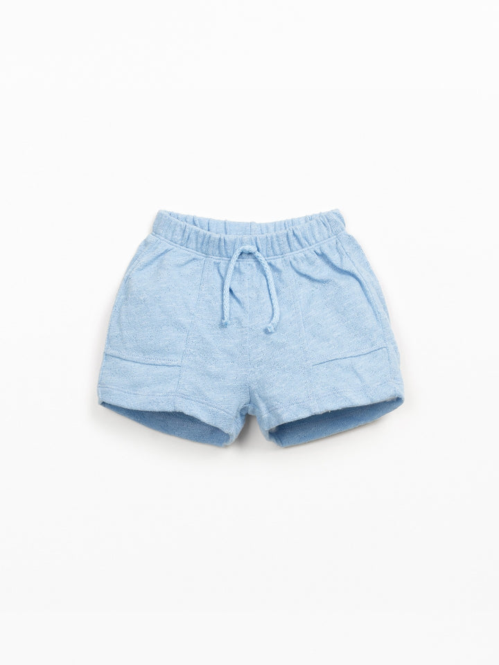 Baby organic cotton light blue shorts with elastic waistband and relaxed fit