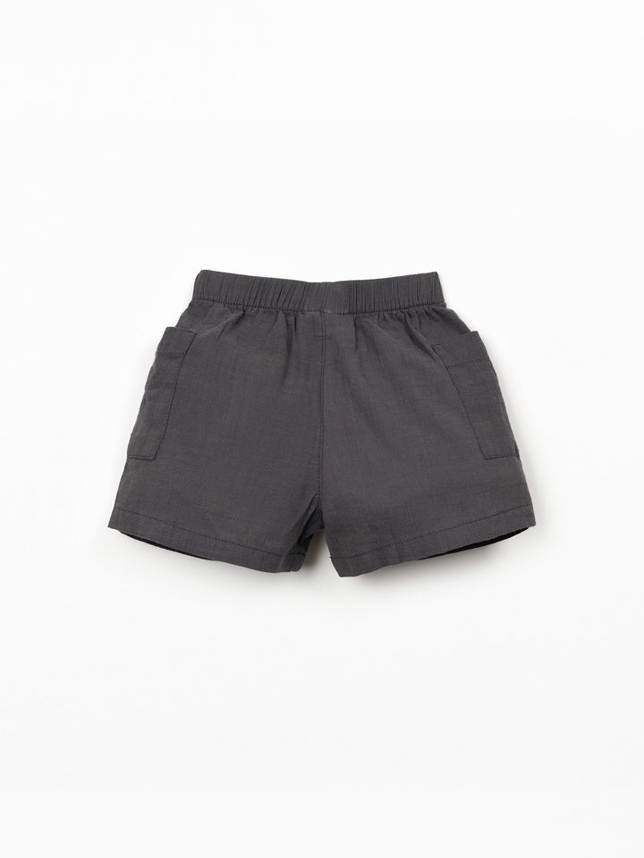 Organic cotton baby boy shorts in charcoal grey with elastic waistband and patch pockets