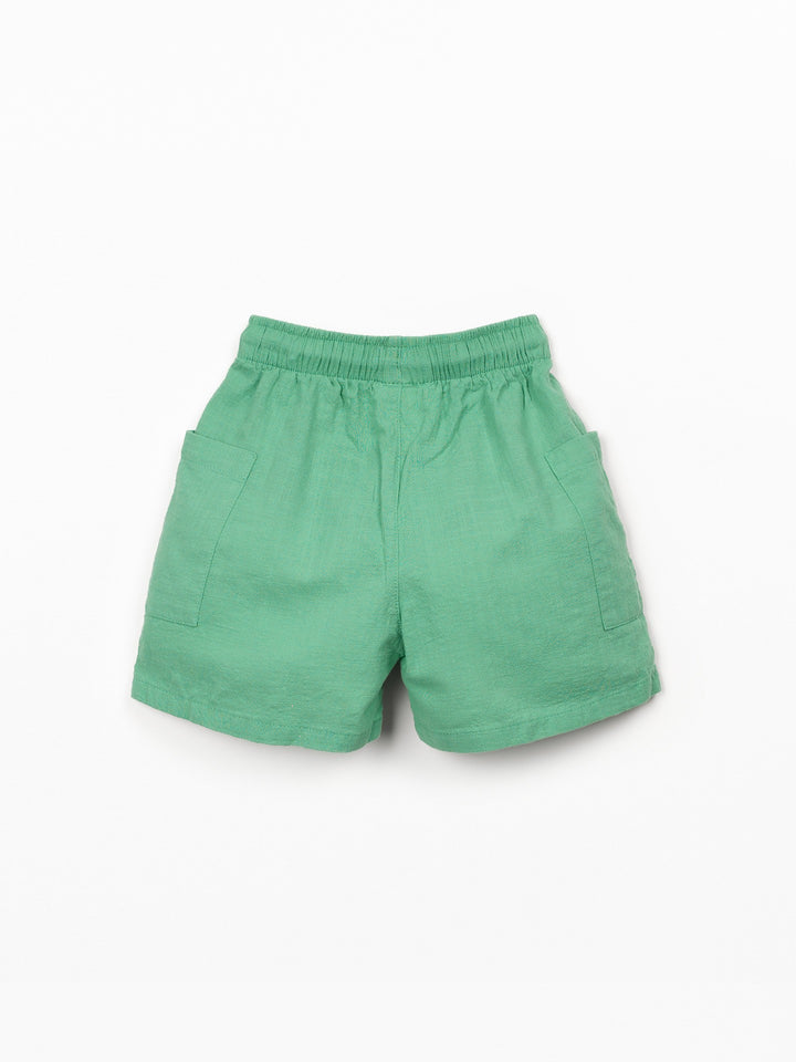 Organic cotton boy shorts in green with elastic waistband and patch pockets