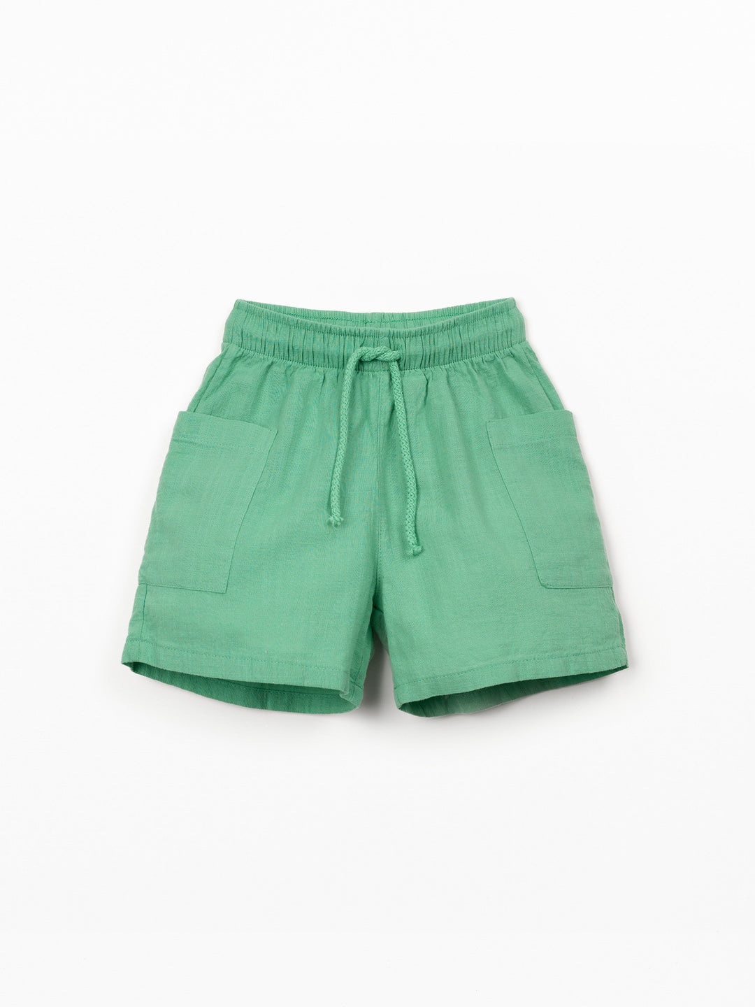 Organic cotton boy shorts in green with elastic waistband and patch pockets