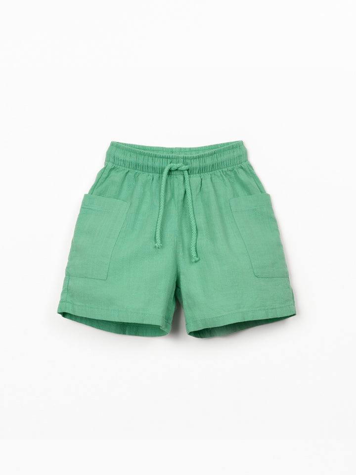 Organic cotton boy shorts in green with elastic waistband and patch pockets