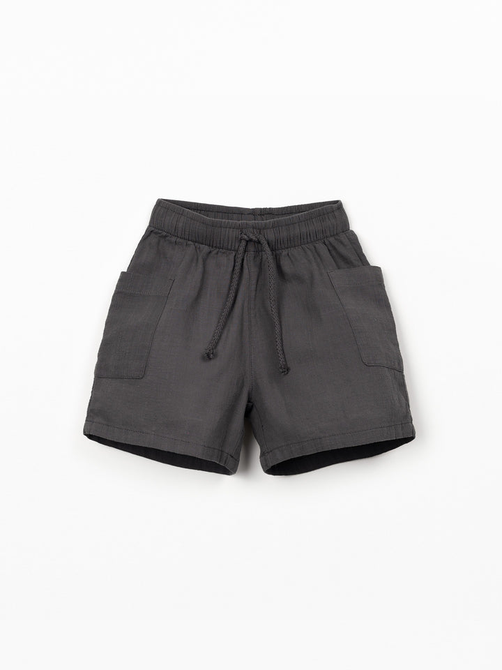 Organic cotton boy shorts in charcoal grey with elastic waistband and patch pockets