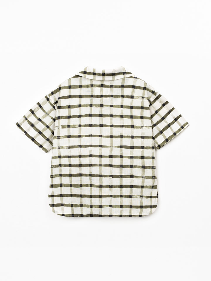 Boy wearing check organic cotton shirt with short sleeves by Play Up