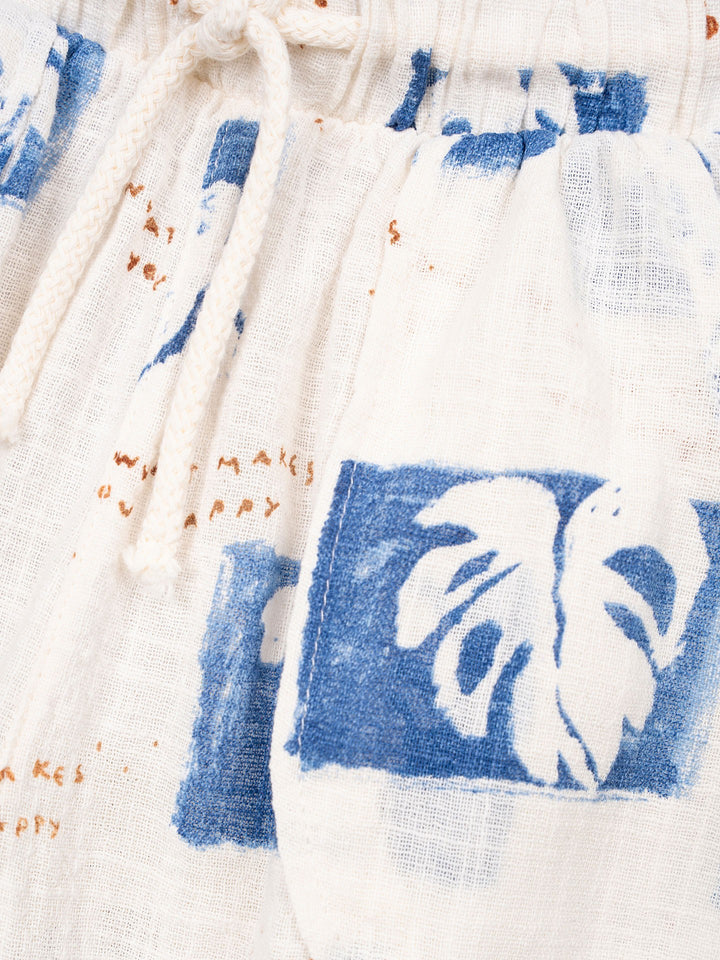 Organic cotton boys trousers with blue tropical leaf print and relaxed fit