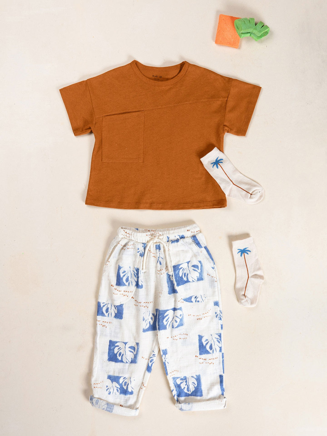 Organic cotton boys trousers with blue tropical leaf print and relaxed fit