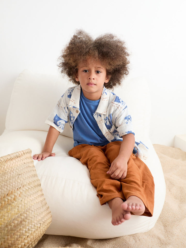 Boy’s organic cotton printed shirt with blue botanical pattern by Play Up