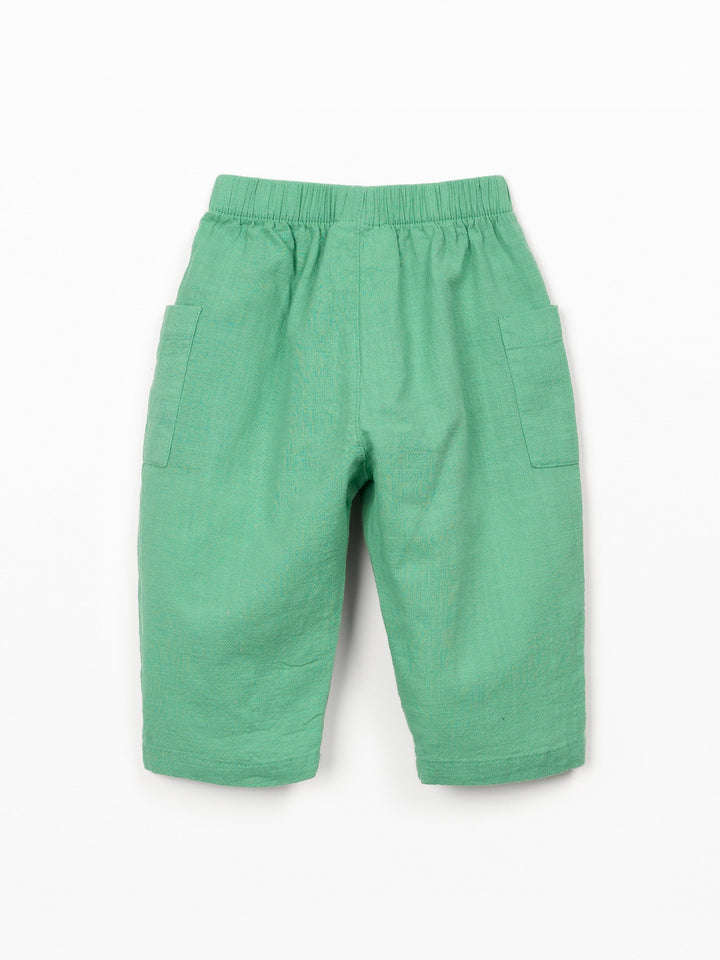 Organic cotton baby boy trousers in soft mint green with patch pockets and elastic waistband