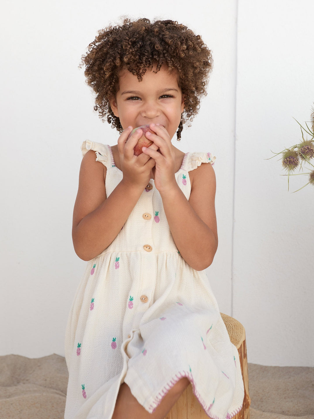 Baby girl pineapple print dress in textured cream cotton with flutter sleeves and wooden buttons