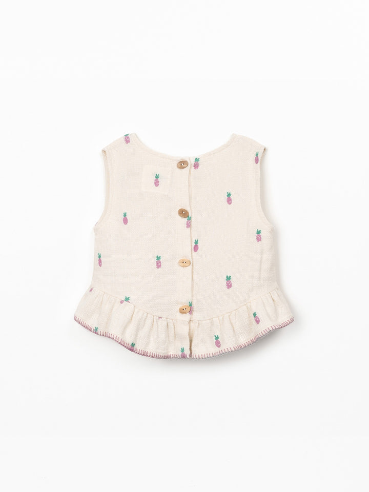 Girls textured cotton pineapple print top with ruffle hem in soft cream fabric