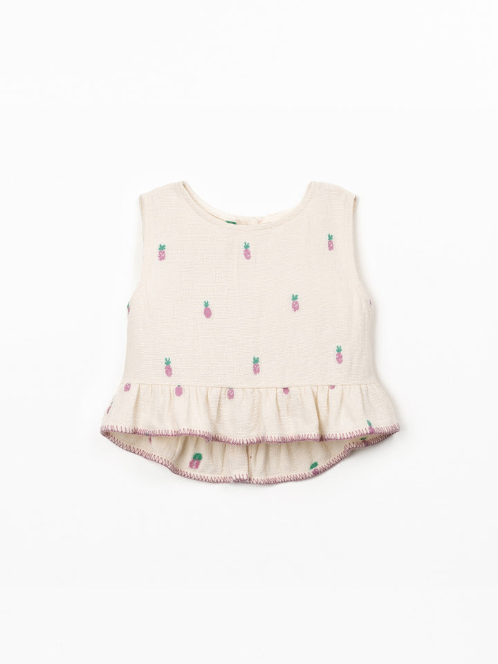 Girls textured cotton pineapple print top with ruffle hem in soft cream fabric