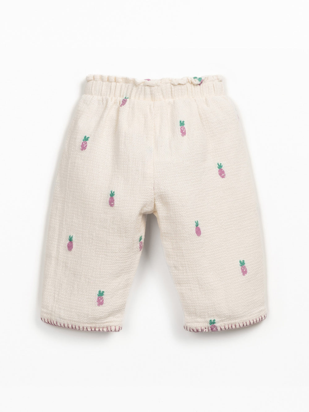 Girls cream textured trousers with pink pineapple print and elastic waistband