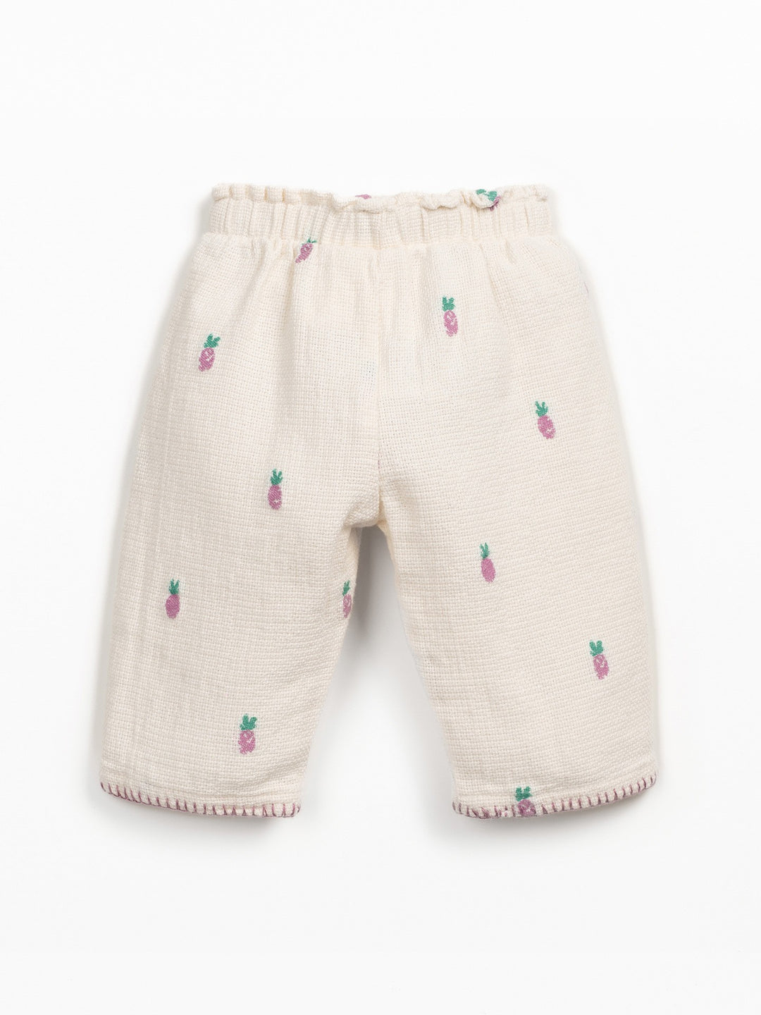Girls cream textured trousers with pink pineapple print and elastic waistband