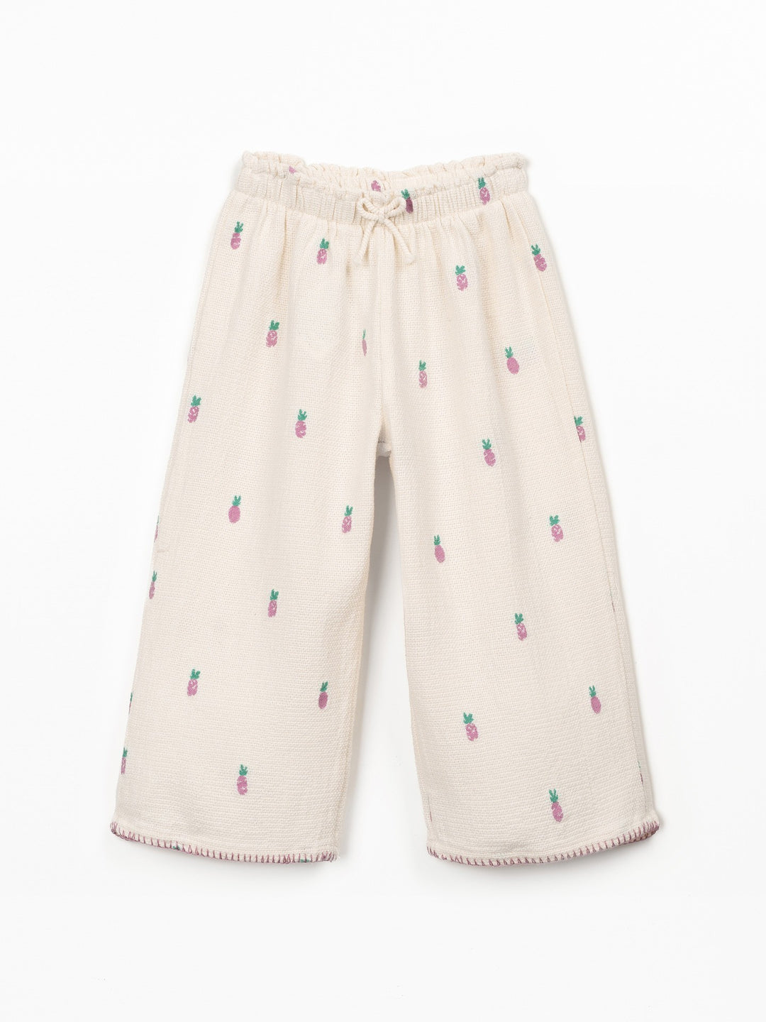 Girls cream textured trousers with pink pineapple print and elastic waistband