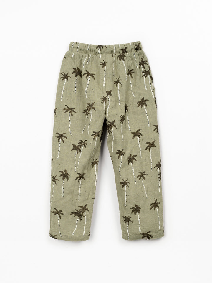 Boy palm tree print trousers in soft sage green cotton with relaxed fit