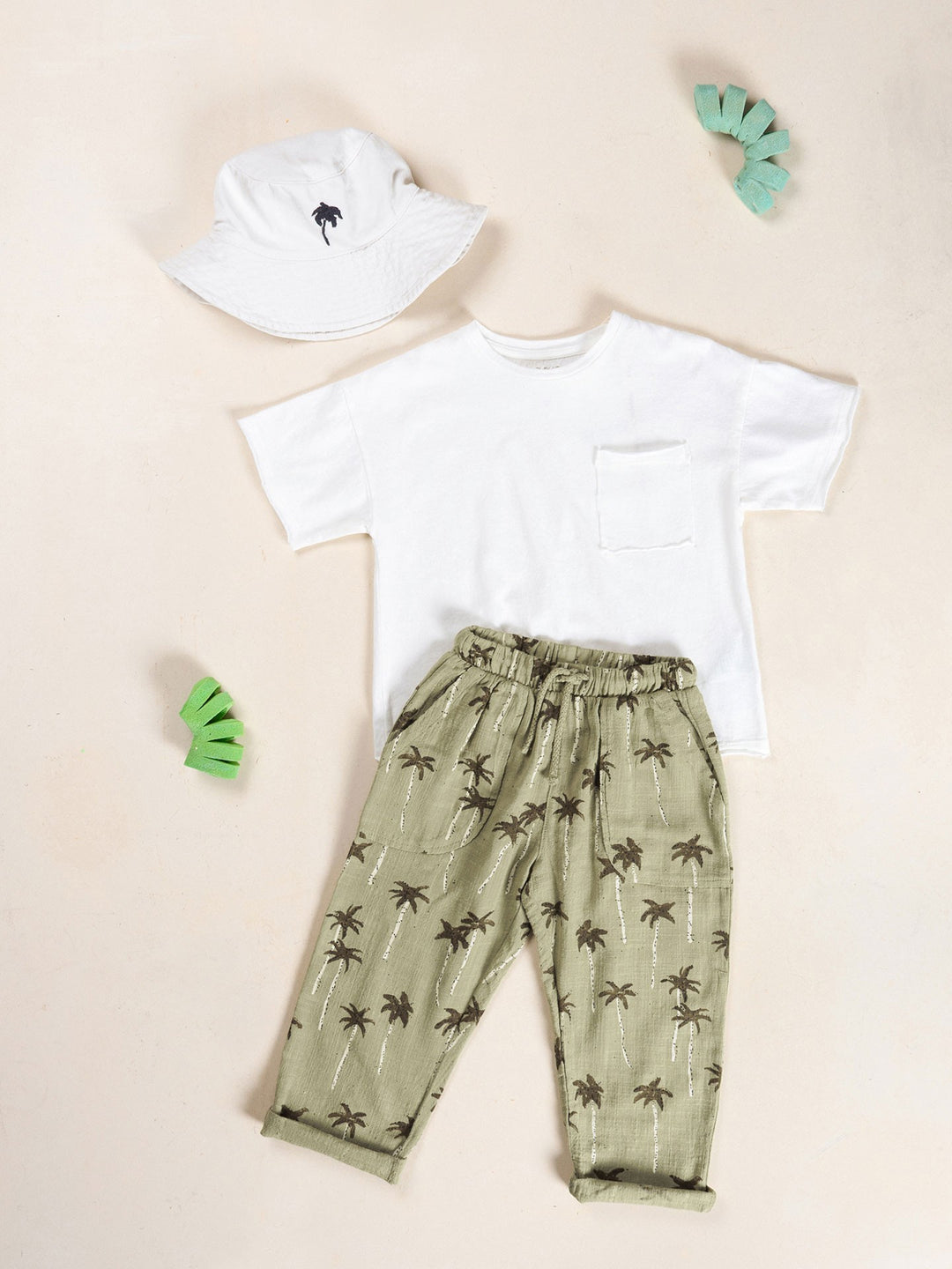 Boy palm tree print trousers in soft sage green cotton with relaxed fit