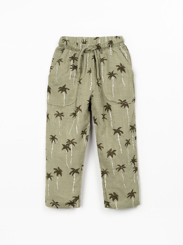 Boy palm tree print trousers in soft sage green cotton with relaxed fit