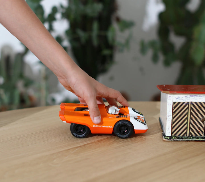 Playforever Zemonsta Egon orange designer toy car with racing-inspired retro styling