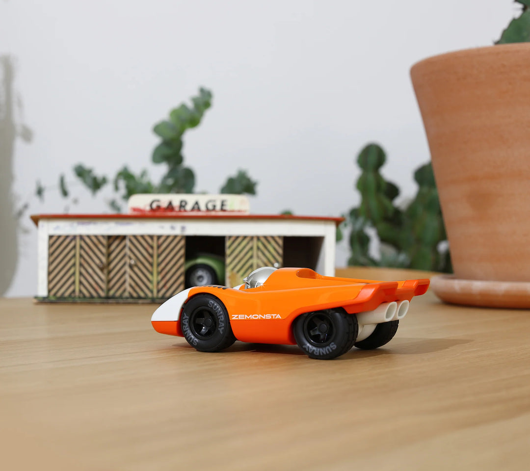 Playforever Zemonsta Egon orange designer toy car with racing-inspired retro styling