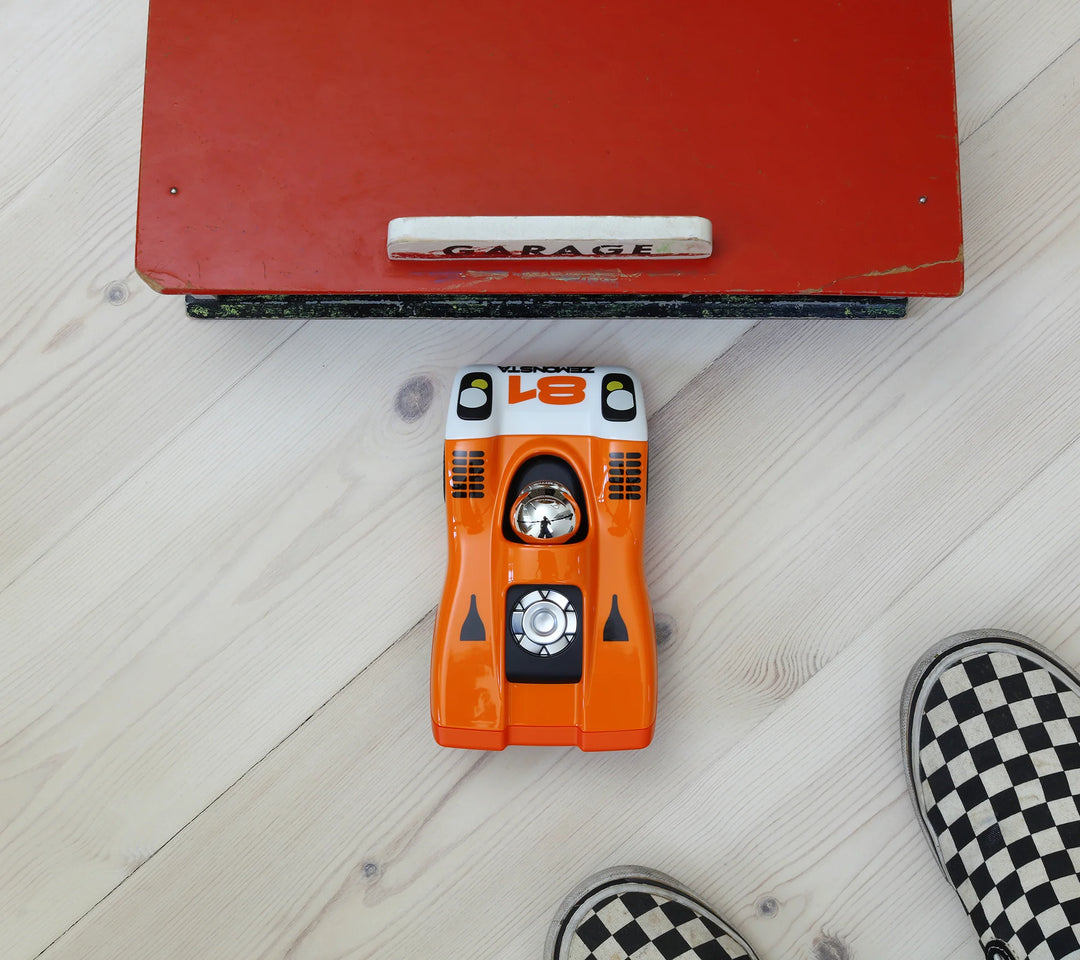 Playforever Zemonsta Egon orange designer toy car with racing-inspired retro styling
