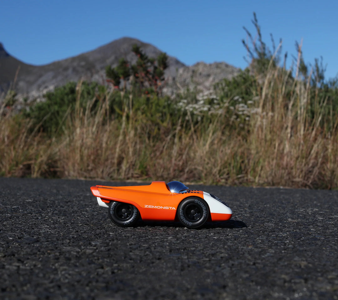 Playforever Zemonsta Egon orange designer toy car with racing-inspired retro styling